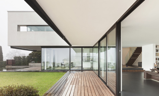 Clear safety film protects first floor windows of modern home 