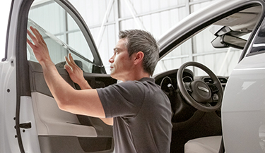 LLumar dealer installing window film 